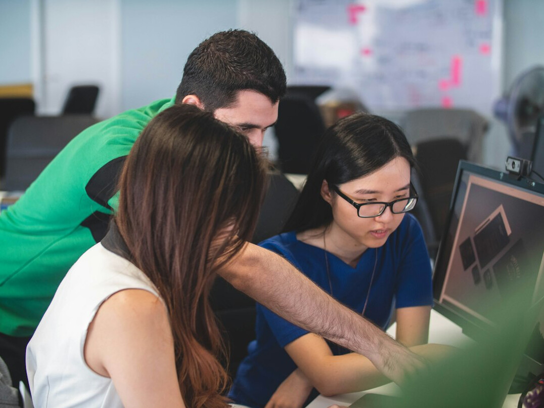diverse team collaborating on code