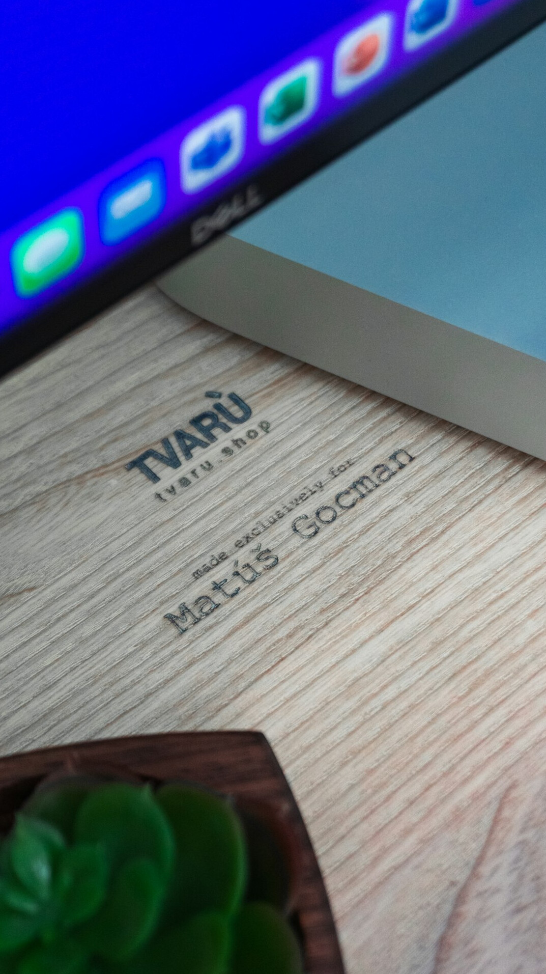 Close-up of code on a laptop screen in a bright workspace