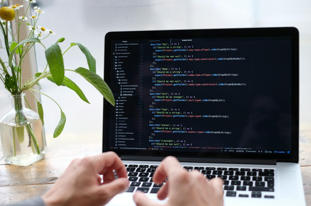 person learning programming on laptop