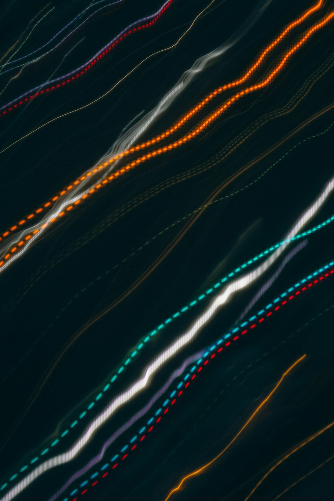 Close-up of colorful lines of code on a dark screen
