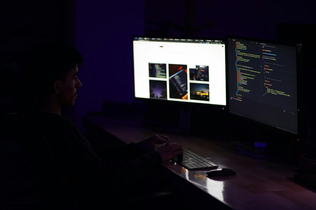 programmer coding at desk