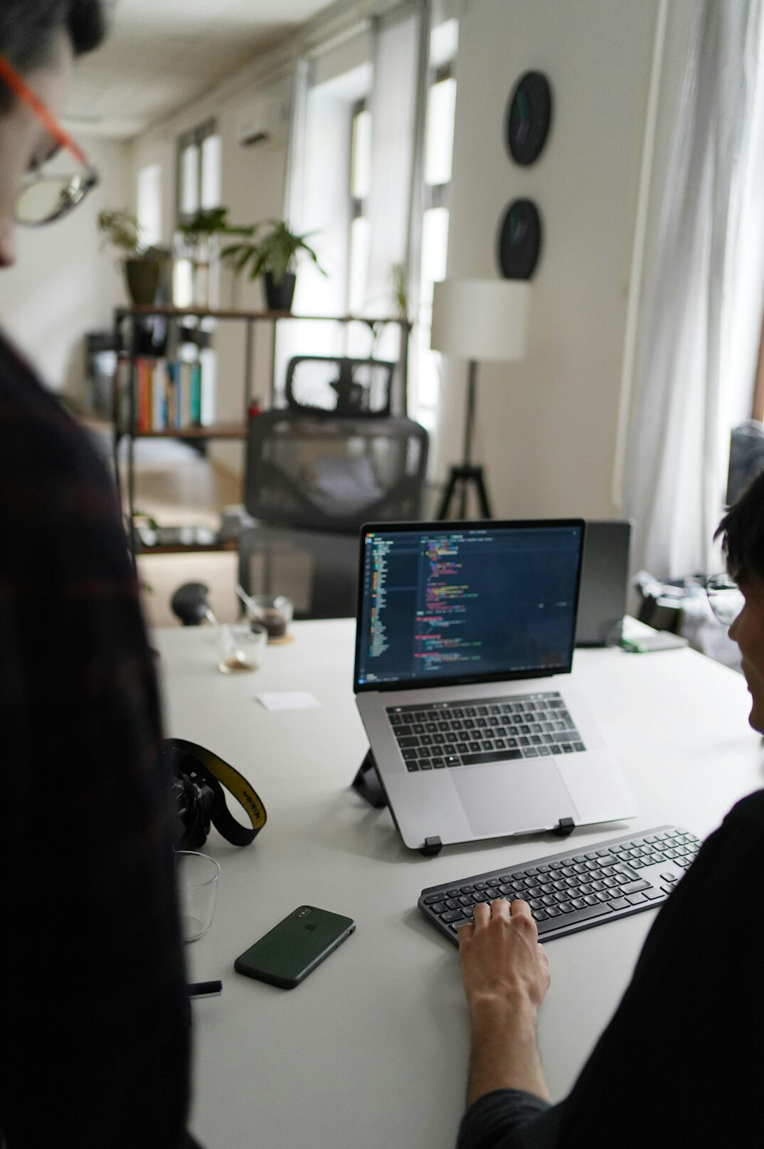 successful programmer at desk