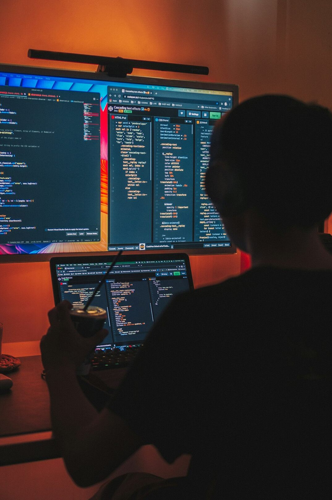 developer coding on laptop