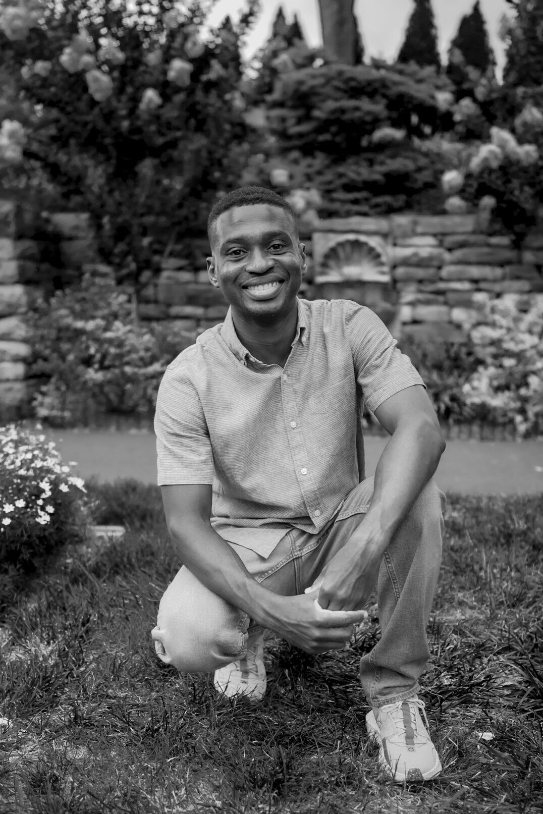 Studio portrait of a smiling young man in his early thirties
